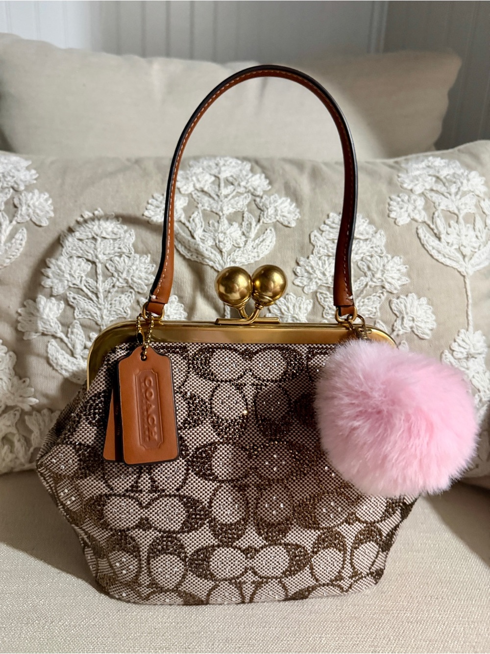 Coach Brown Signature Canvas Kiss-Lock Top Handle Bag with Pink Pom